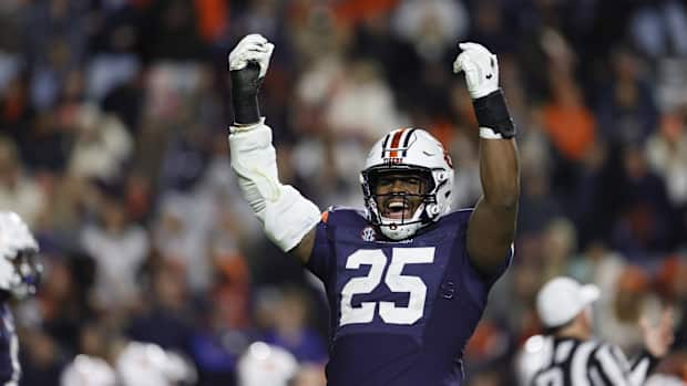 Nov 12, 2022; Auburn, Alabama, USA; Auburn Tigers defensive end Colby Wooden (25) tries to get the fans excited starting the fourth quarter against the Texas A&M Aggies at Jordan-Hare Stadium. Mandatory Credit: John Reed-USA TODAY Sports